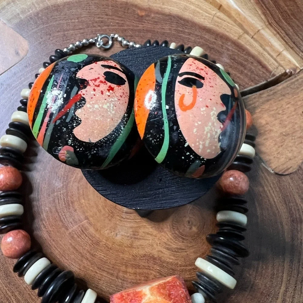 Three piece, rust and black stone and beaded costume jewelry.